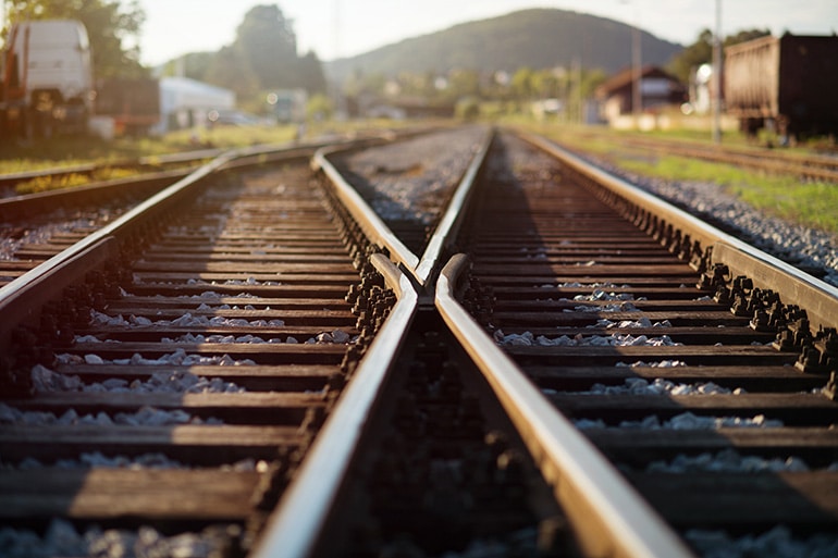 Two train tracks that connect illustrating the paths forward you can take.