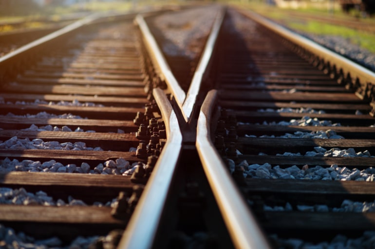 Two train tracks and the point where they diverge